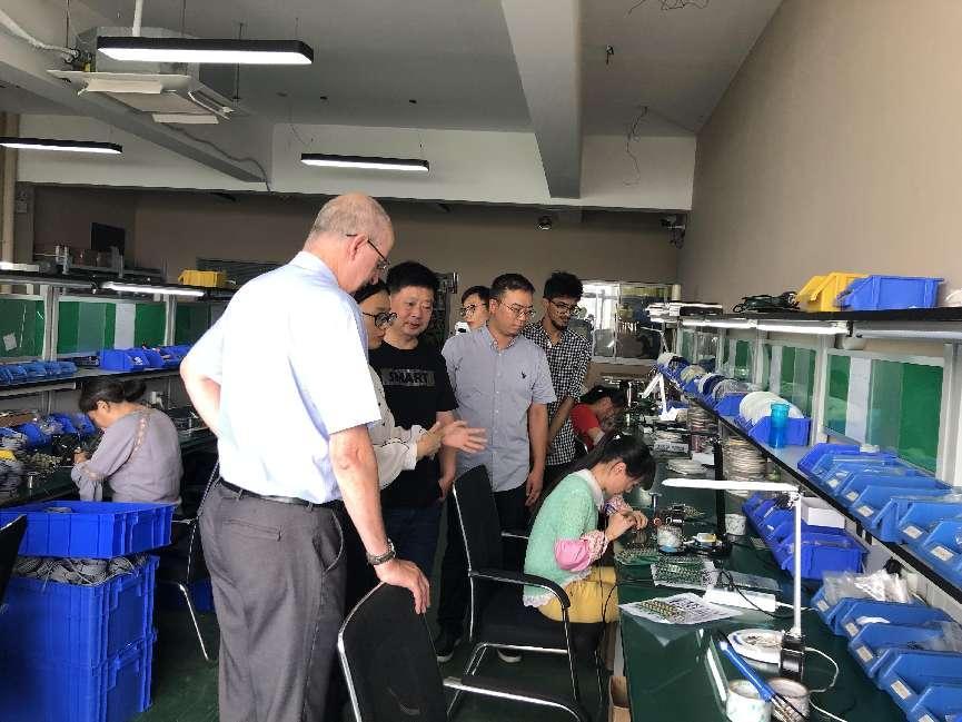 John, CEO of a famous American electrical company, visited our factory